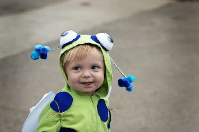 Little boy playing in a baby bug costume