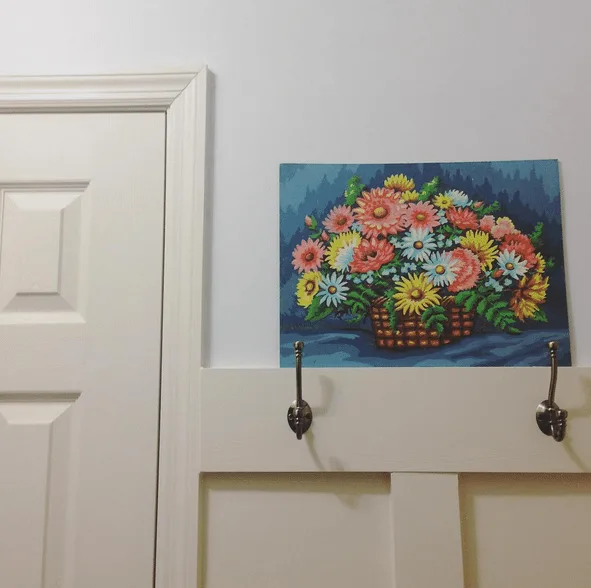 Floral Paint by Number in teh Laundry Room. Board and Batten paired with large hooks and light gray paint. by @craftivityd 