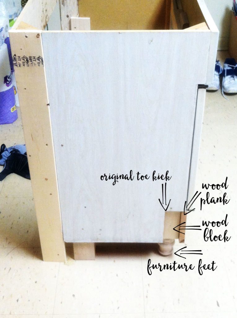 White cabinet being made taller for a bathroom vanity makeover. 