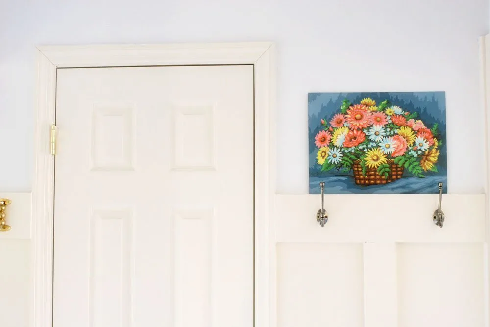 double wall hooks in a mudroom laundry room combo