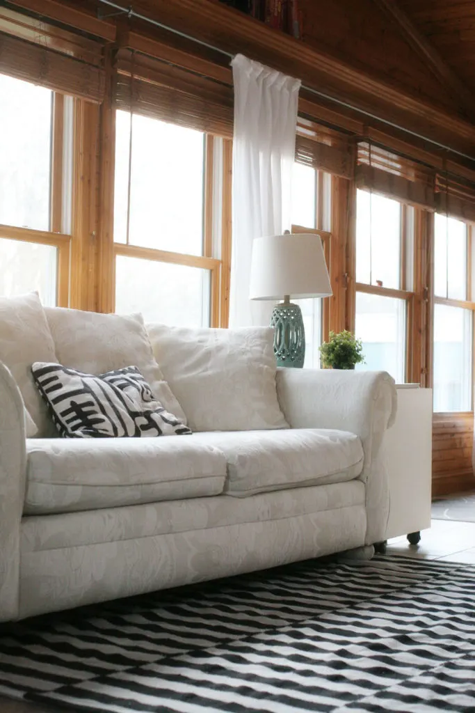 Choosing a Rug Pad for Tile Floors by @CraftivityD // Sunroom, Family Room, Black & White Rug
