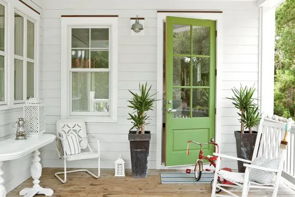 White exterior home with a chartreuse door idea