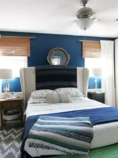 Navy Master Bedroom: navy walls, upholstered headboard, custom wardrobes, white bedding, upholstered ottoman, white curtains, bamboo blinds by @CraftivityD