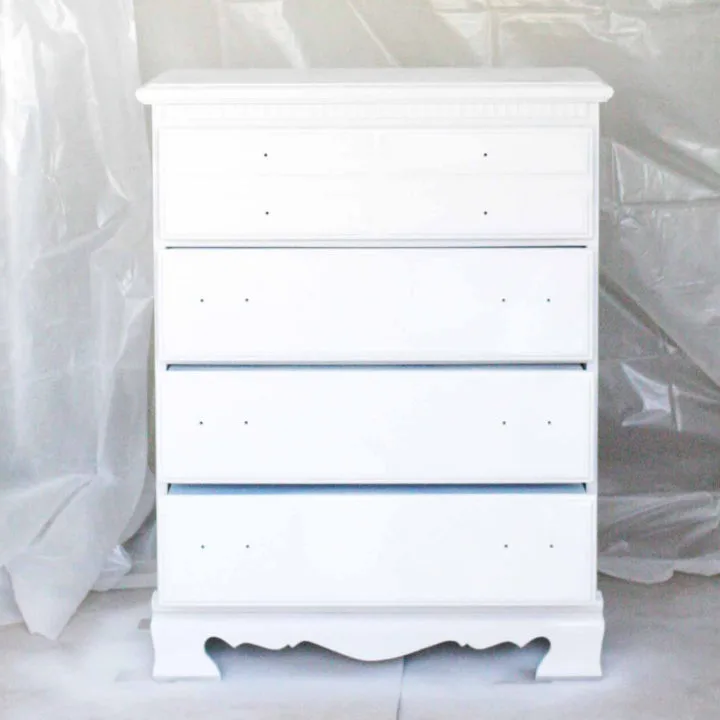 How to spray paint indoors! Build a DIY Spray Paint Booth in your garage. It's a portable, any size, easy setup, option for spraying paint indoors. Great for furniture, cabinetry, projects and more. Click the image to get the tutorial.