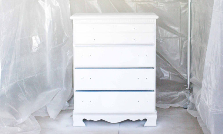 How to spray paint indoors! Build a DIY Spray Paint Booth in your garage. It's a portable, any size, easy setup, option for spraying paint indoors. Great for furniture, cabinetry, projects and more. Click the image to get the tutorial.