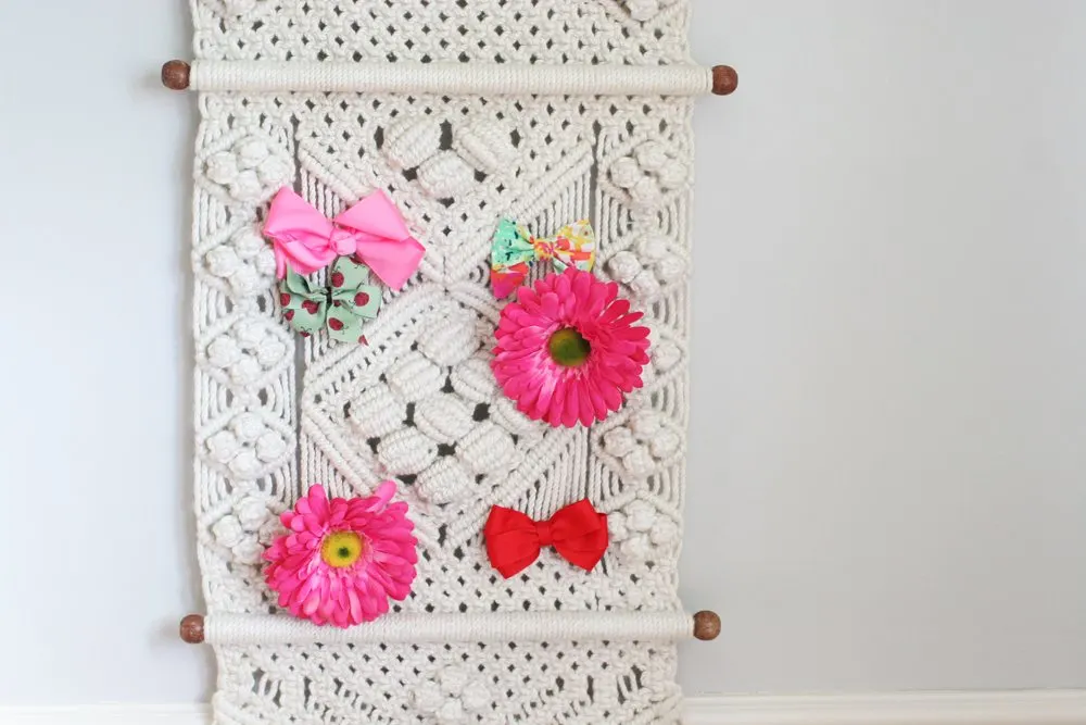 Macrame wall hanging to hold hair bows for nursery on a budget