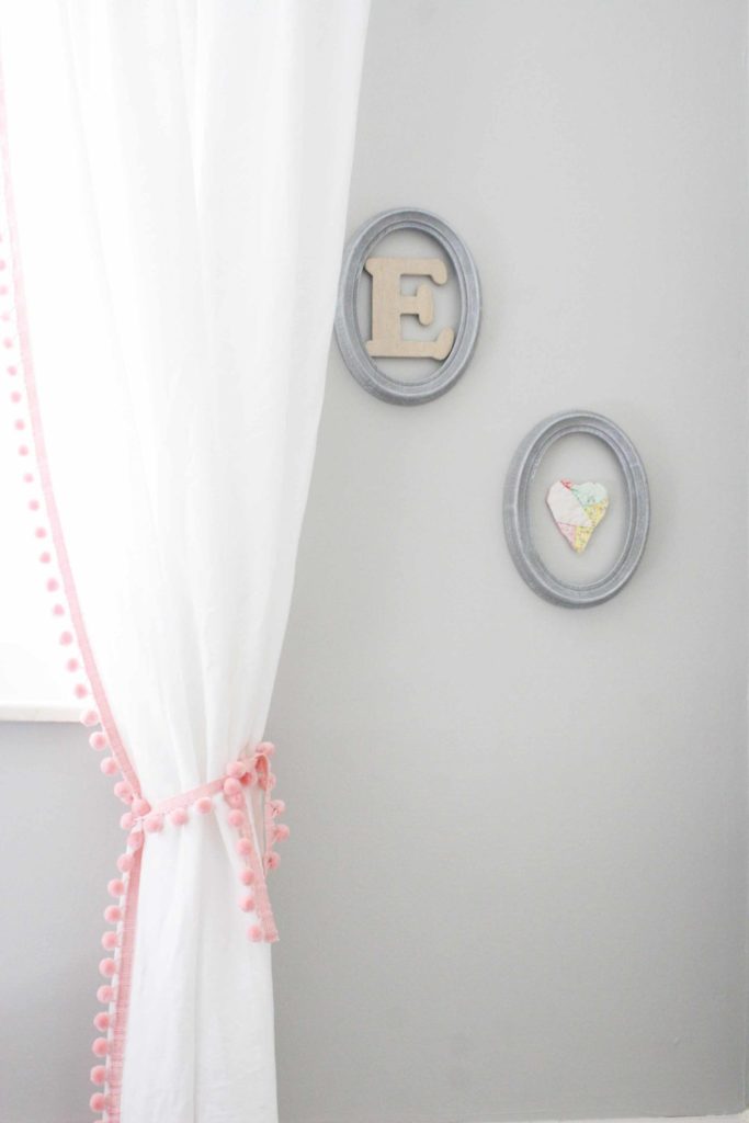 use empty frames for wall decor in a budget nursery