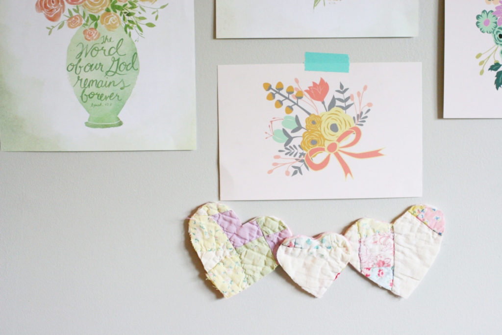 Pieces of Antique Quilts cut into heart for a bohemian nursery