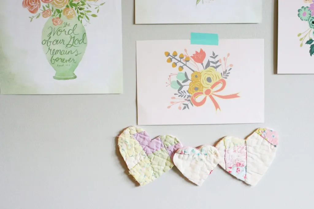 Pieces of Antique Quilts cut into heart for a bohemian nursery