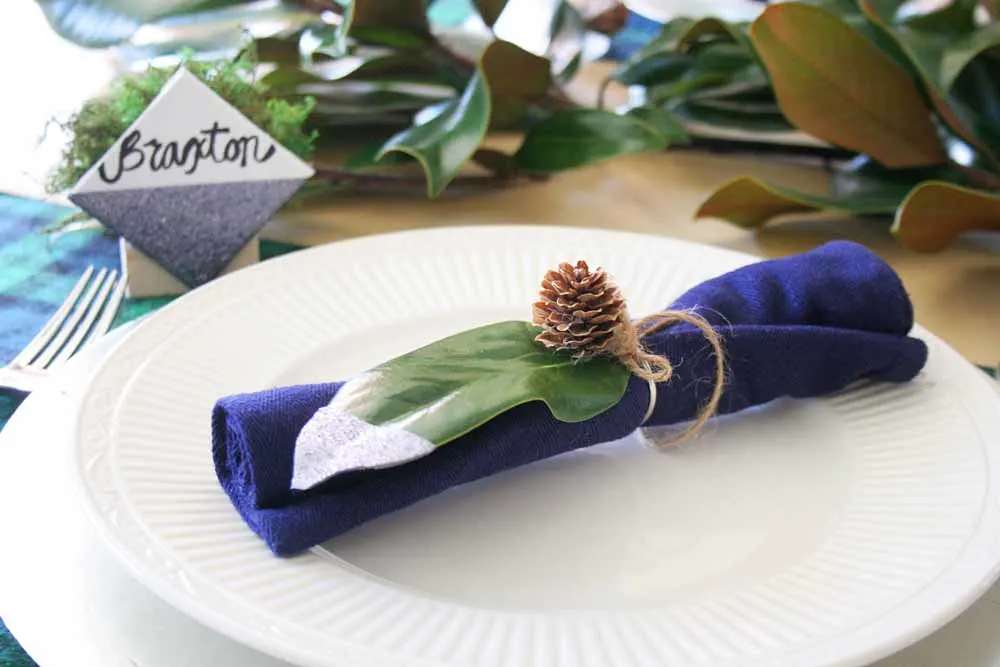 table setting with magnolia leaf napkin ring, glitter tipped magnolia leaf