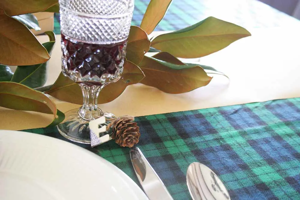 You'll love these easy Christmas table ideas that can be made in minutes, including DIY napkin rings, name card holders, and drink markers. #tablescape #party #christmas