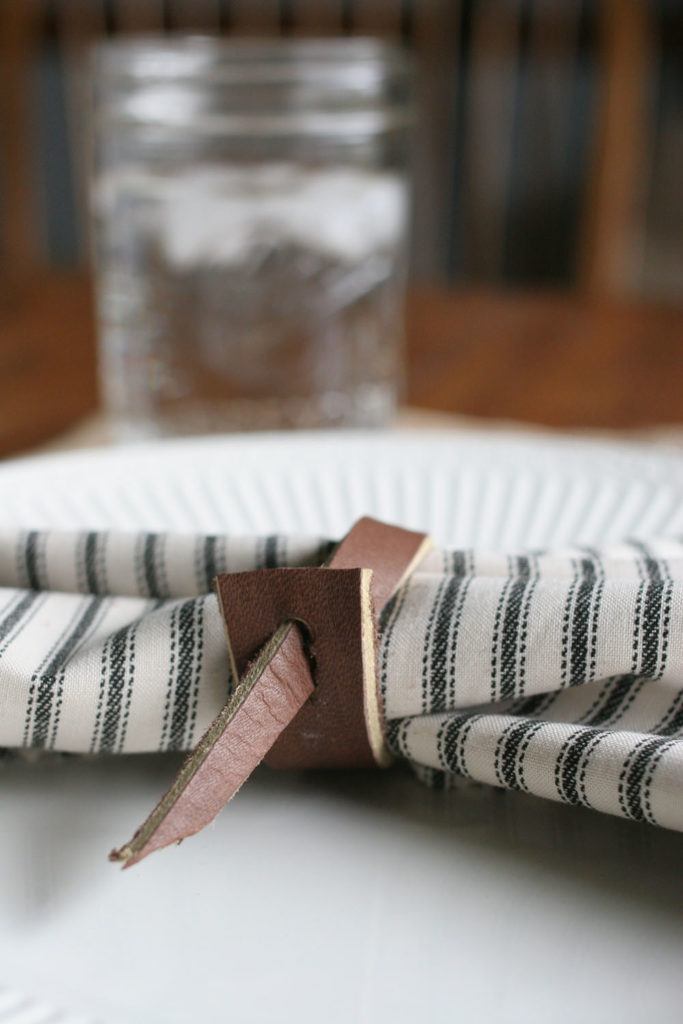 leather napkin ring, ticking cloth napkin