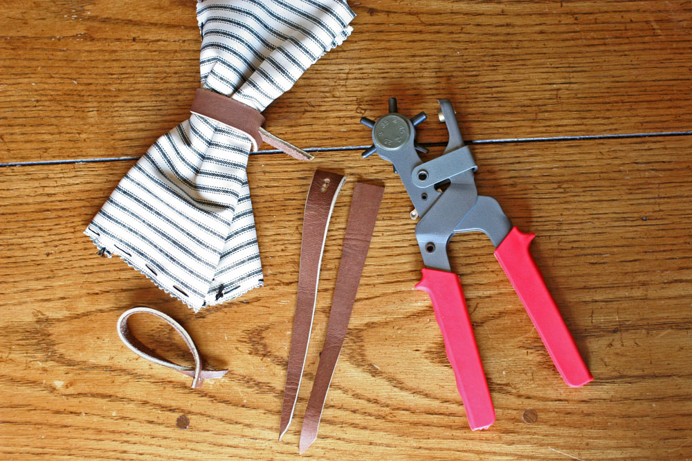 leather scraps, leather hole punch, diy napkin rings, ticking cloth napkin