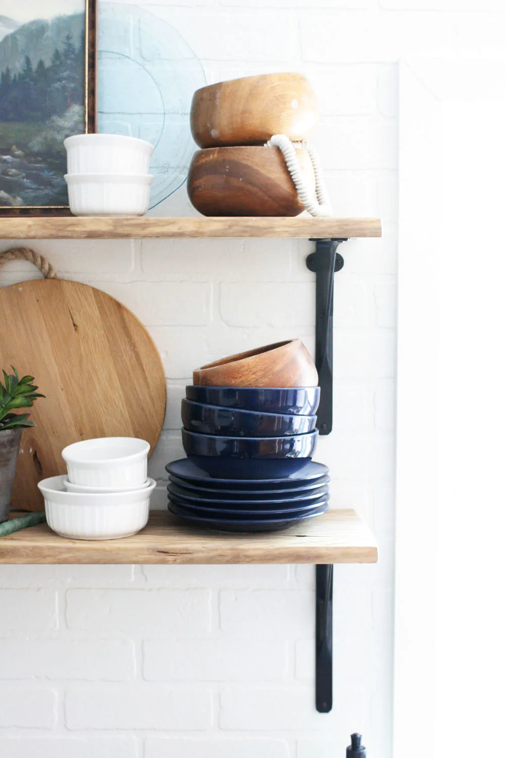 open shelving and brick backsplash in a budget kitchen remodel