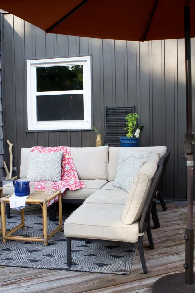 Dark Gray Board and Batten Siding (Vertical Siding) and Outdoor Patio Furniture on a Deck