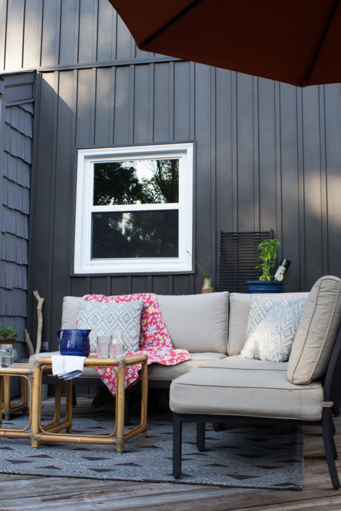 Dark Gray Board and Batten Siding (Vertical Siding) and Outdoor Patio Furniture on a Deck