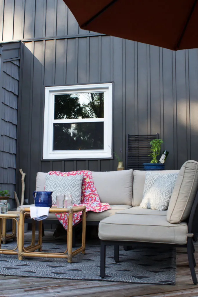 Dark Gray Board and Batten Siding (Vertical Siding) and Outdoor Patio Furniture on a Deck