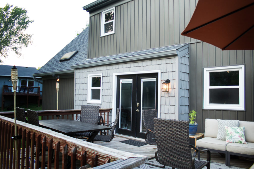 Dark Gray Board and Batten Siding (Vertical Siding), Light Gray Shake Siding, and Outdoor Patio Furniture on a Deck