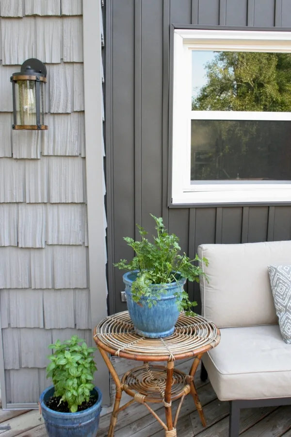 Dark Gray Board and Batten Siding (Vertical Siding), Light Gray Shake Siding, and Outdoor Patio Furniture on a Deck