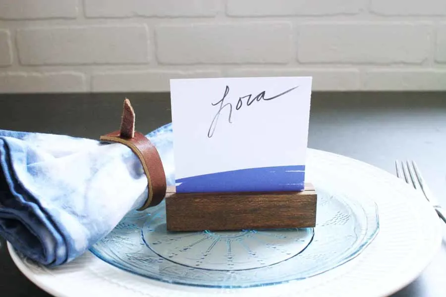 Wood Place Card Holder with Navy Place Card, Shibori Fabric Napkin with Leather Napkin Ring, Blue and White Plates