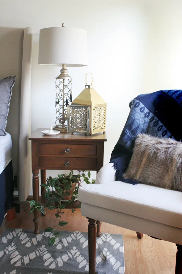 Eclectic Bedroom with Vintage Night Stand and Upholstered Wingback Chair