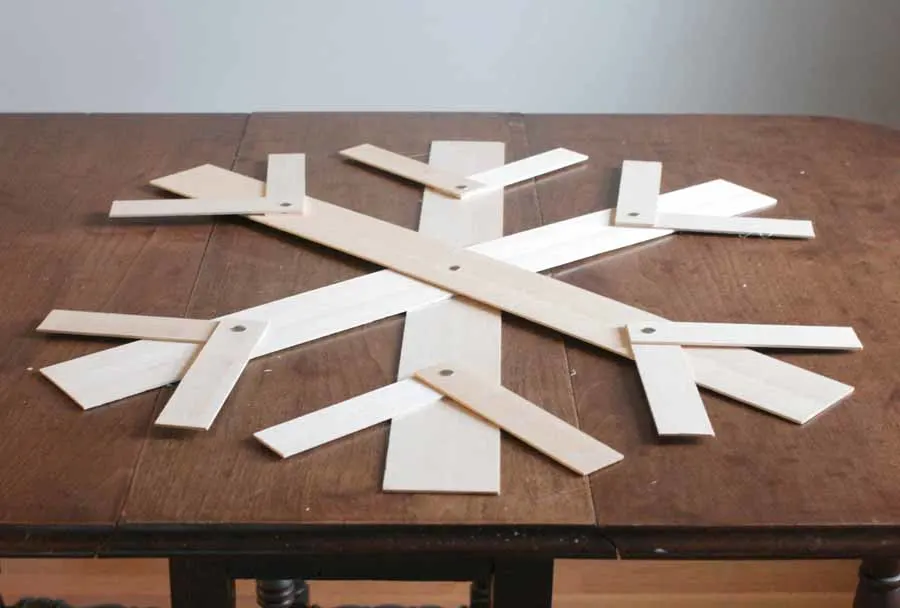 add thumbtacks to wood snowflake for additional support