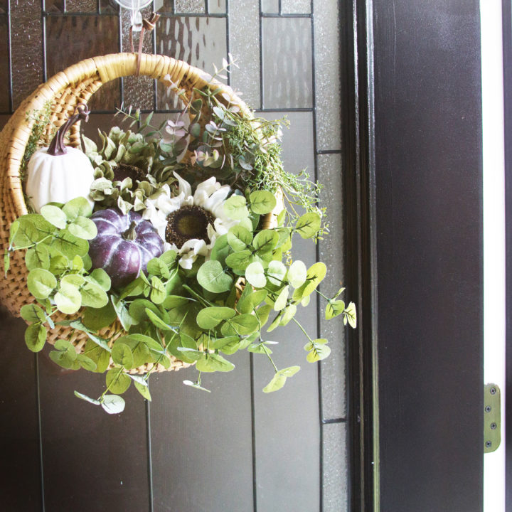 fall basket wreath on black front door