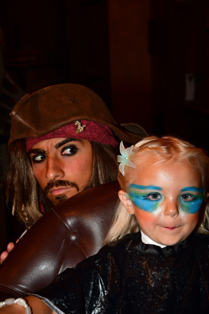 Captain Jack Sparrow surprising preschooler who is getting mermaid makeover at the Pirates League.