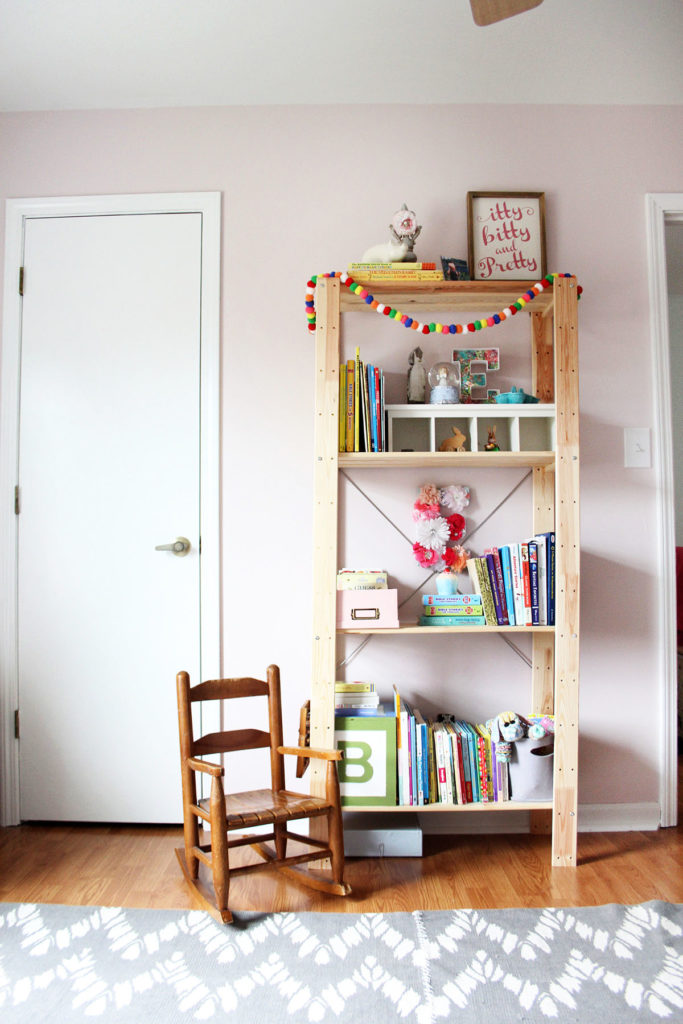 A Pink Girls Bedroom with vintage rocker and wood bookshelf by Craftivity Designs