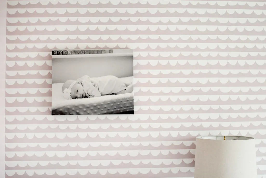 A pink bedroom with B&W  print hanging on pink and white wallpaper - ideas for a little girls bedroom - by Craftivity Designs