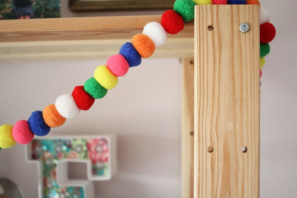 A wood bookshelf with colorful pom poms - little girl bedroom ideas - by Craftivity Designs