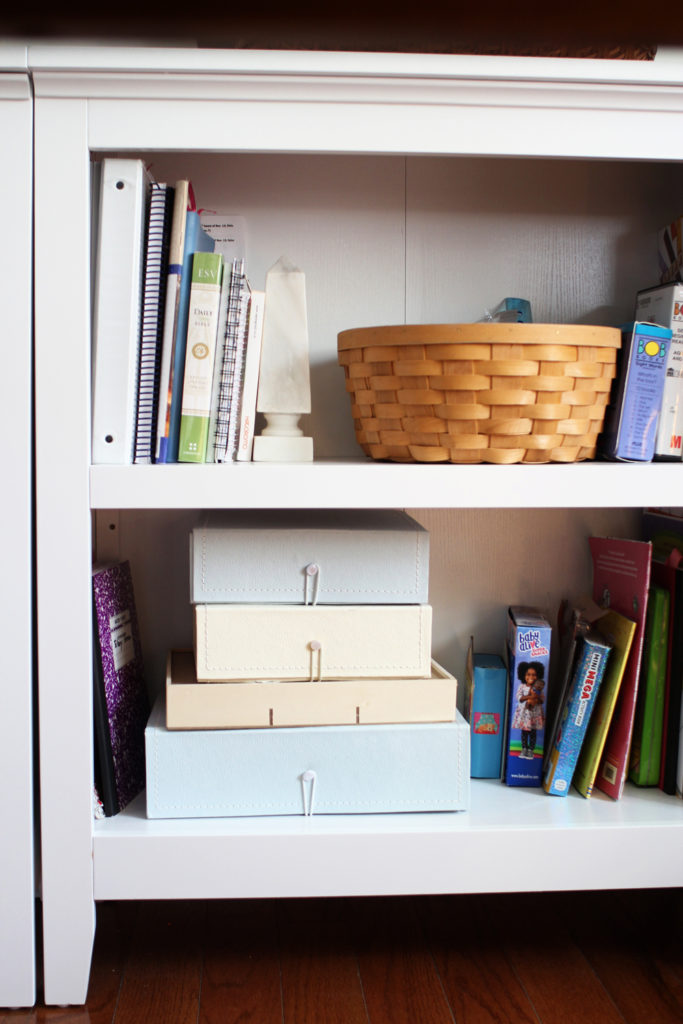 Organize a homeschool room with bookshelves, baskets, and decorative boxes