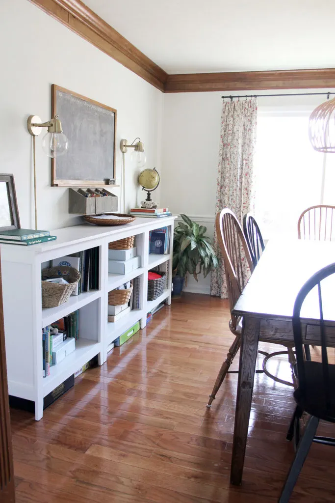 Dining Room and Homeschool Room combination with white bookshelves for storage