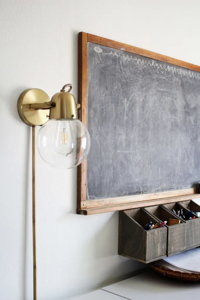 Homeschool Room with chalkboard, wall sconce, and wall mounted organizer