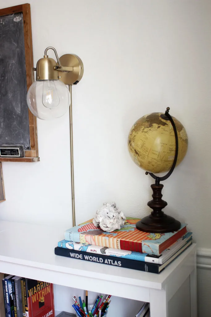 Vintage globe and vintage atlas in a homeschool room
