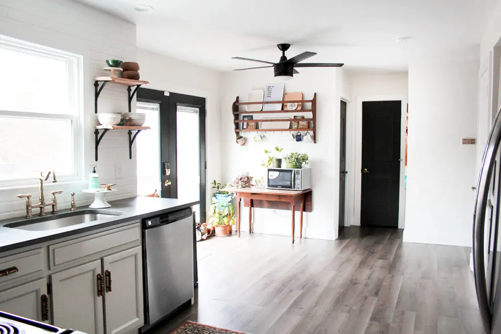 Budget kitchen remodel with gray painted cabinets and dark interior doors