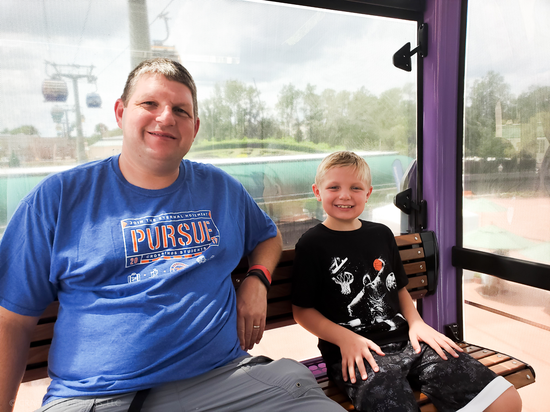 Father and sun on Disney Skyliner