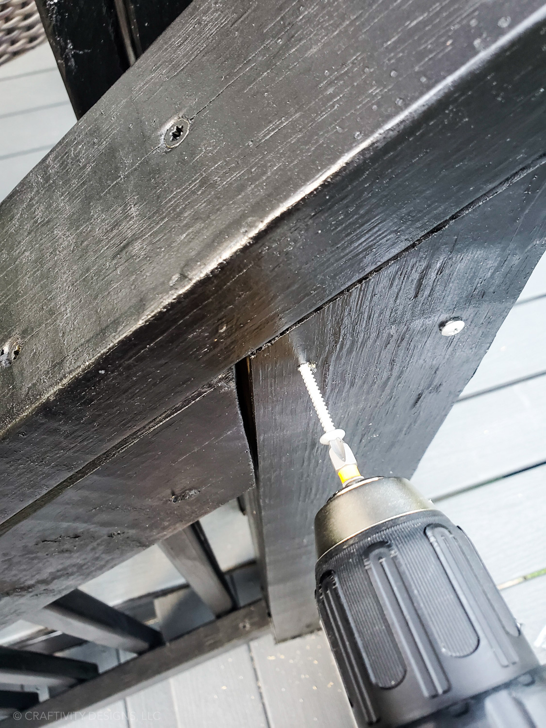 drill two screws to install deck rail lights