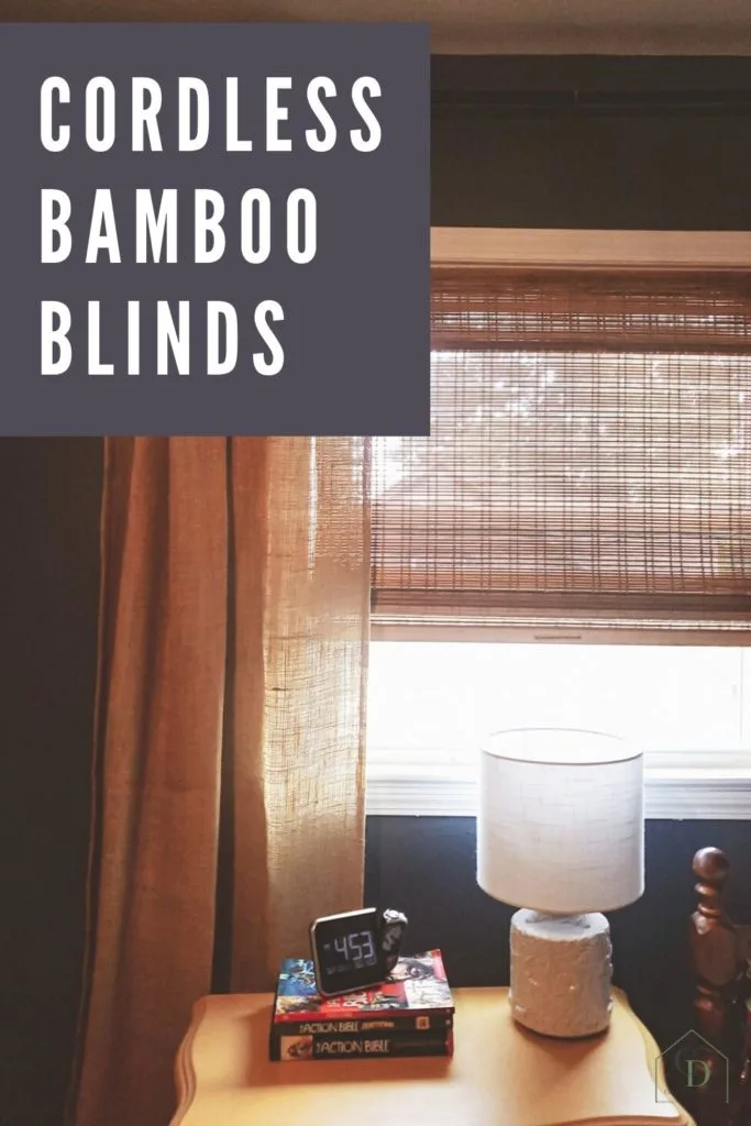 Cordless Bamboo Blinds in a boys bedroom with navy walls and yellow nightstand