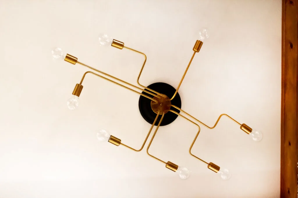 modern black and gold semi flush mount light for living room with low ceilings and dark living room