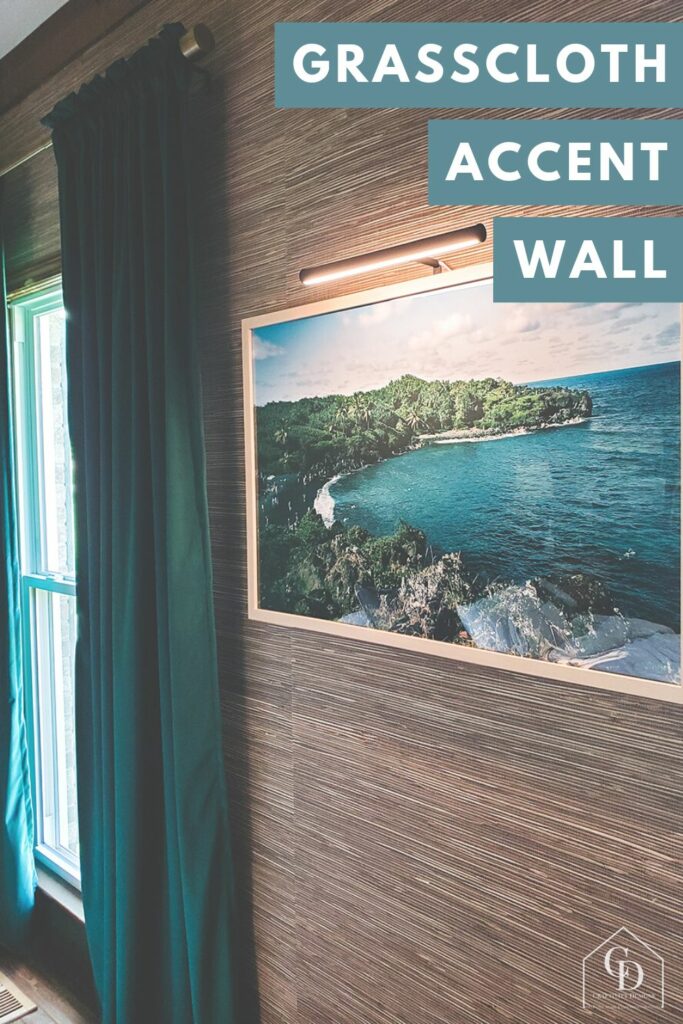 grasscloth wallpaper accent wall in a master bedroom with green curtains and beach art