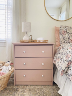diy pink dresser as a nightstand in a girl's bedroom