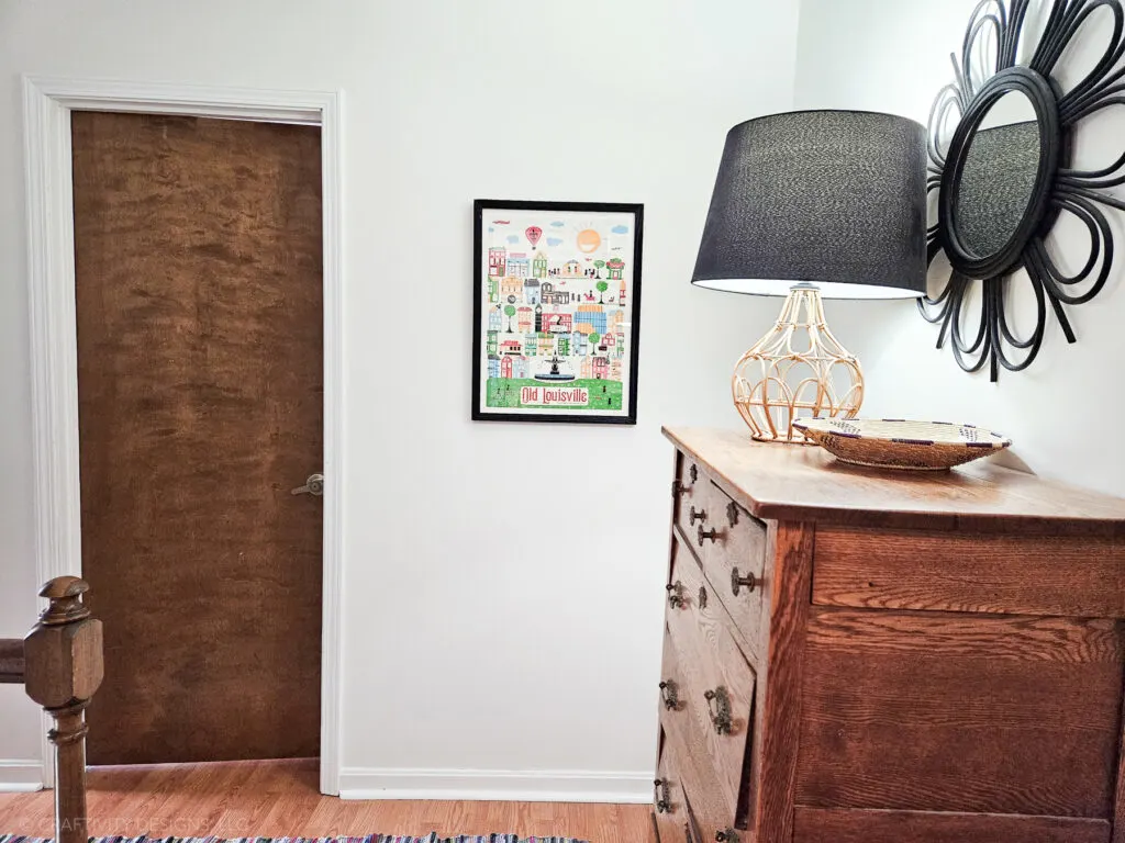 stained wood door with white trim