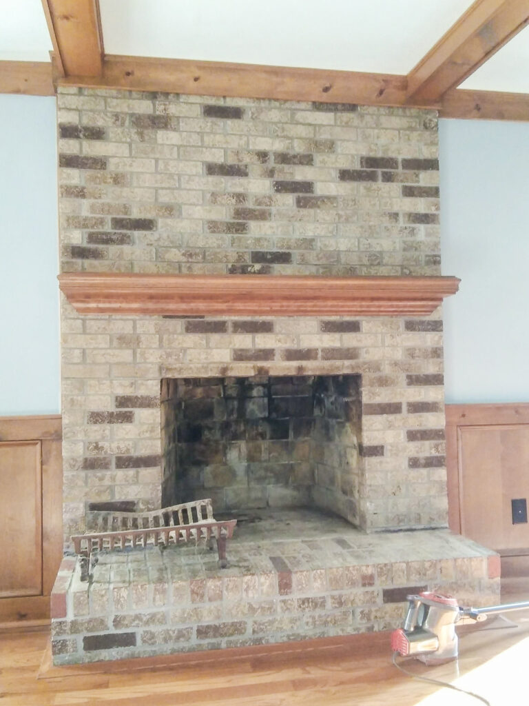 clean the inside of a non-working fireplace and prep the firebox for painting