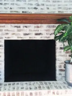 inside of fireplace painted black with heat safe paint, german scheam brick paint