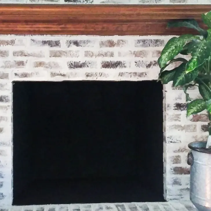 inside of fireplace painted black with heat safe paint, german scheam brick paint