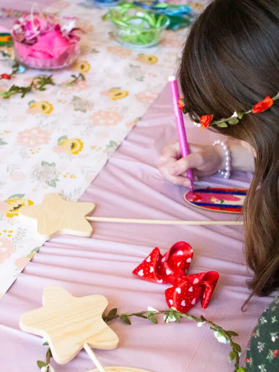 child completing fairy crafts at a fairy birthday party