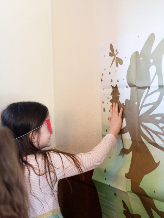 child playing pin the star on the wand at a fairy birthday party