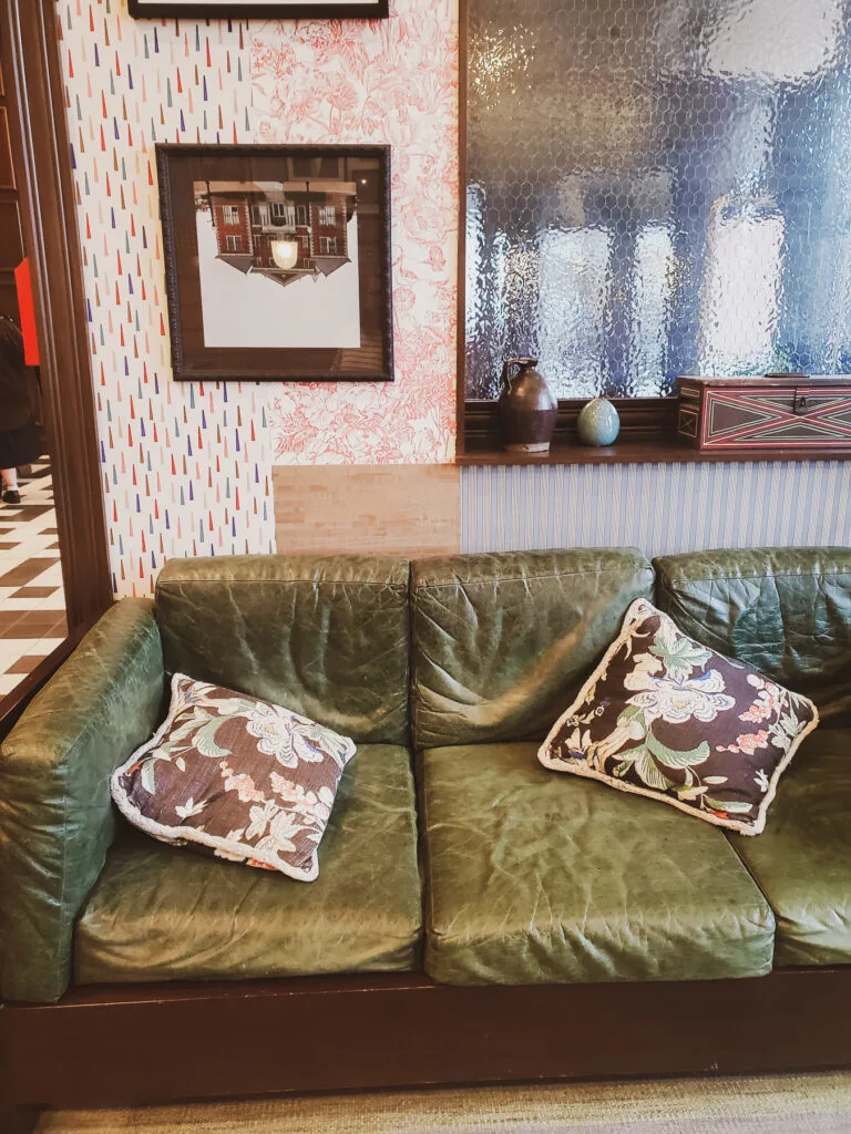 lobby study area graduate bloomington review, mixing wallpapers and stranger things artwork with mid-century furniture