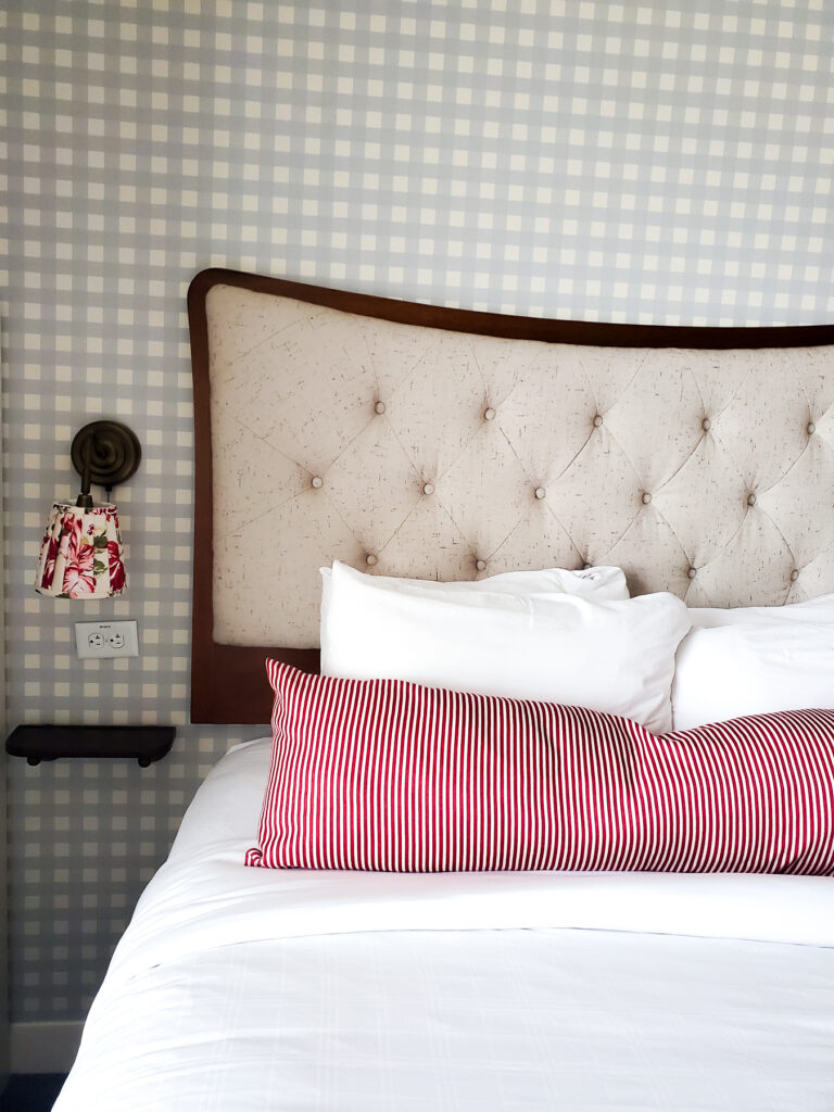 guest room beds graduate bloomington review, check wallpaper with a floral print sconce